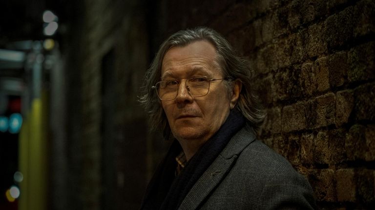 This image released by Apple TV+ shows Gary Oldman in...