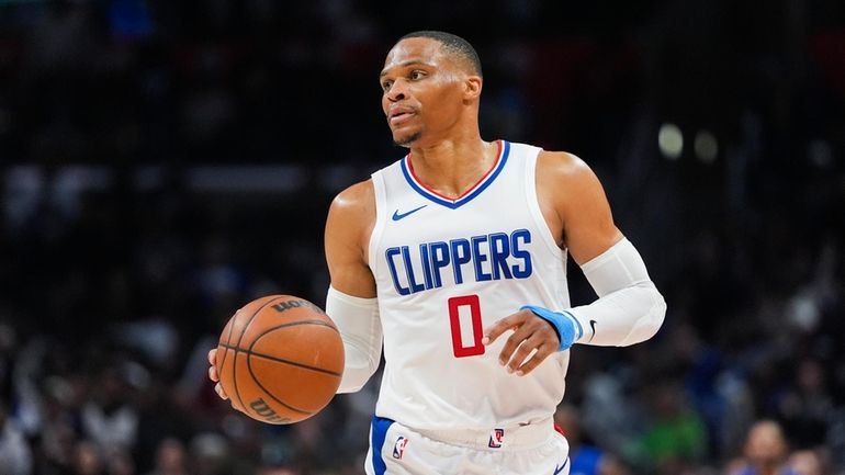 Los Angeles Clippers guard Russell Westbrook moves up the court...