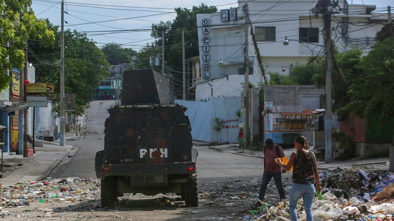 An armored police vehicle patrols in Port-au-Prince, Haiti, Monday, June...