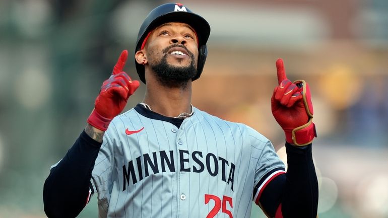 Minnesota Twins' Byron Buxton approaches home plate after a solo...