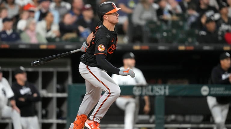 Baltimore Orioles' Ryan Mountcastle watches his RBI ground rule double...