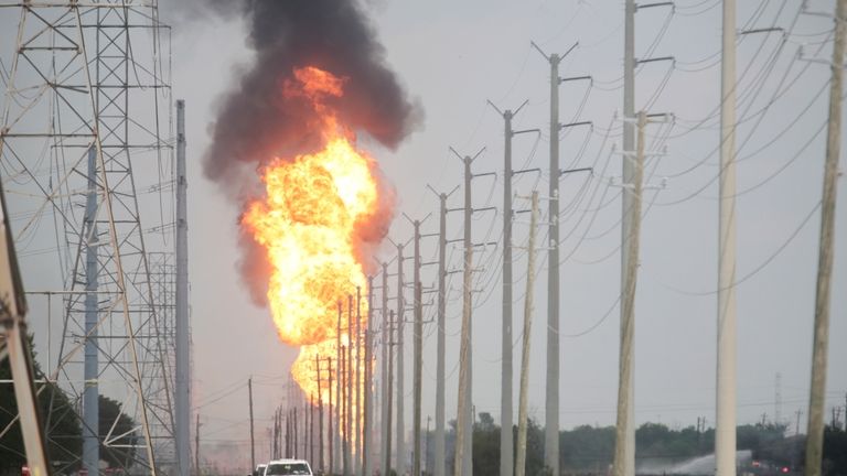 A pipeline carrying natural gas liquids burns near La Porte,...