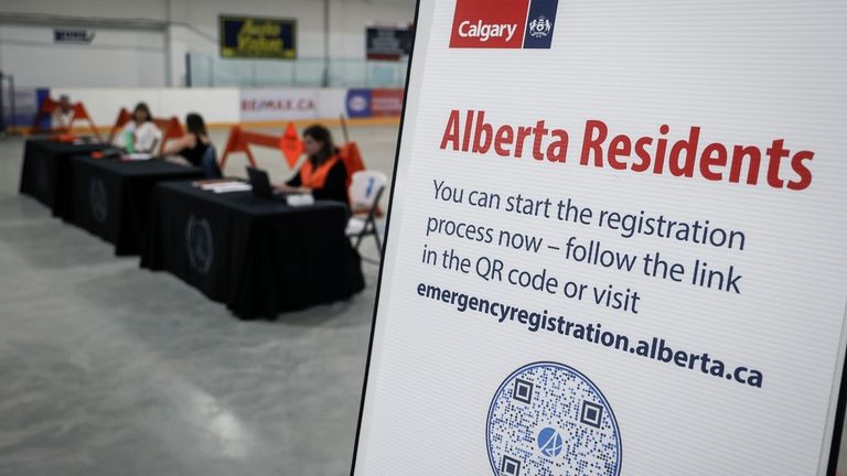 A reception center is readied for wildfire evacuees forced from...