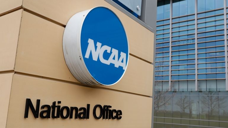 Signage at the headquarters of the NCAA is viewed in...