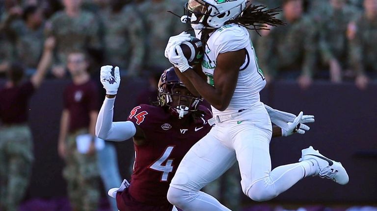 Marshall wide receiver Christian Fitzpatrick (16) has a pass broken...