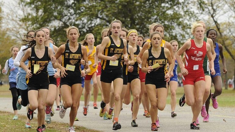 Runners compete near the start of the girls 5k run...