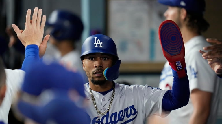 Mookie Betts of the Los Angeles Dodgers celebrates after catching