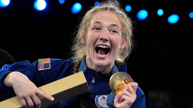 United State's Sarah Hildebrandt celebrates with her gold medal during...