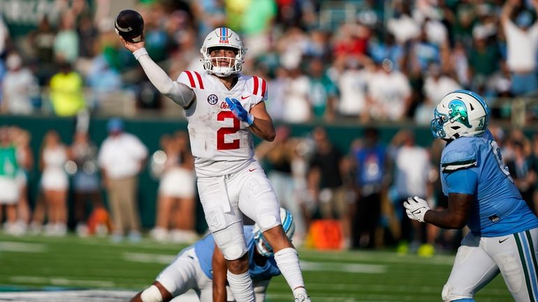 Mississippi quarterback Jaxson Dart (2) throws a touchdown pass it...