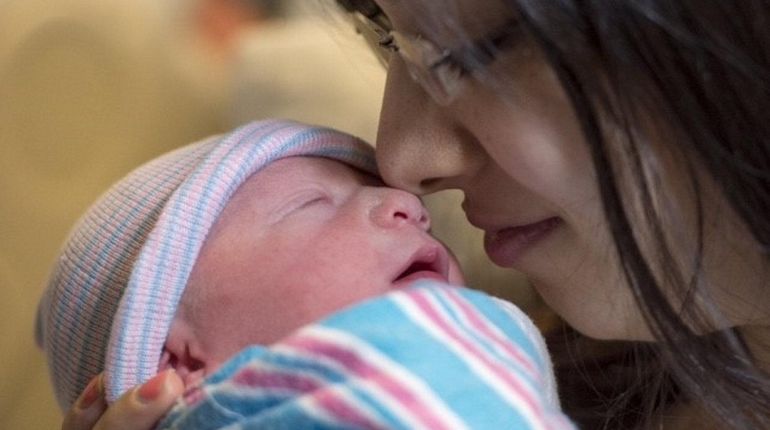 Daniella Malakov of Forest Hills with her newborn baby boy,...