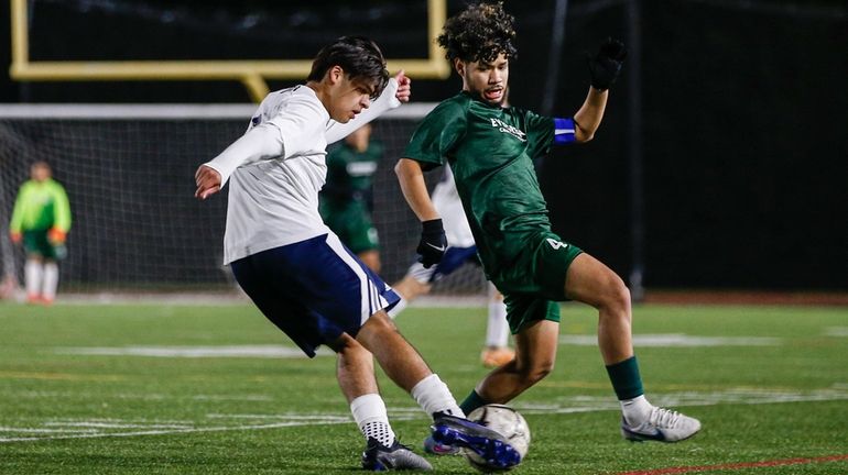 Alexis Mendoza #6 of Mount Academy battles for the ball...