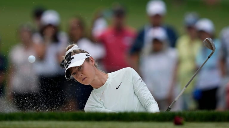 Nelly Korda hits out of a bunker on the first...