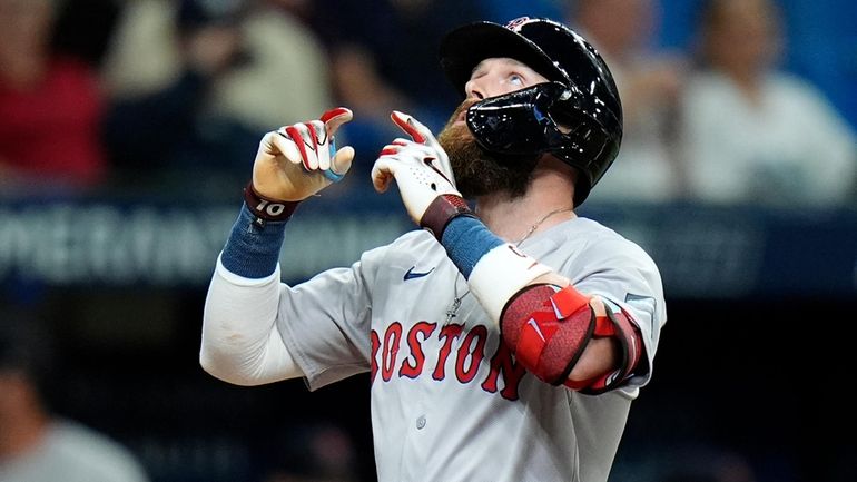 Boston Red Sox's Trevor Story celebrates his home run off...