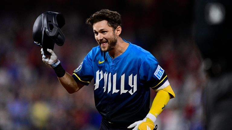 Philadelphia Phillies' Trea Turner celebrates after hitting a walk-off RBI-single...