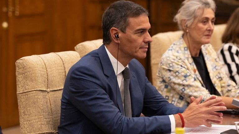 Spain's Prime Minister Pedro Sanchez, left, attends his meeting with...