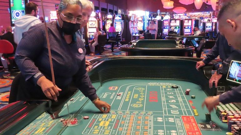 Dealers conduct a game of craps at the Ocean Casino...