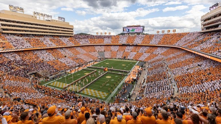 Tennessee players run onto the field at Neyland Stadium before...