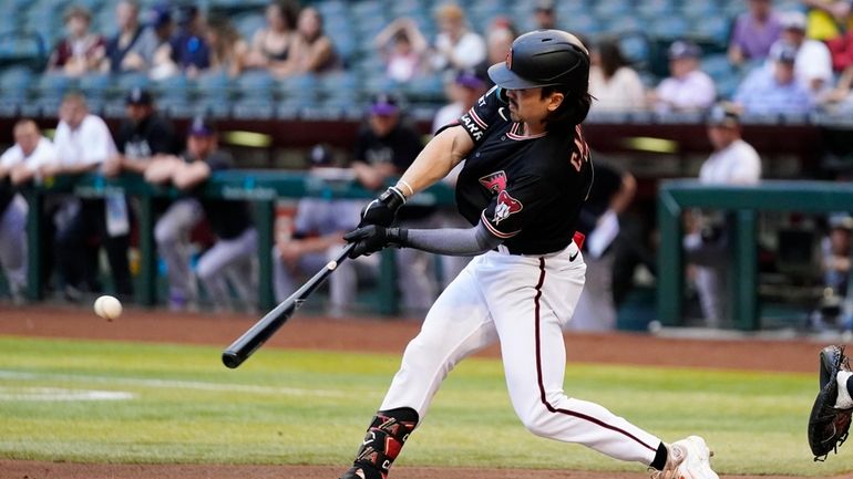 Arizona Diamondbacks' Corbin Carroll hits an RBI single against the...