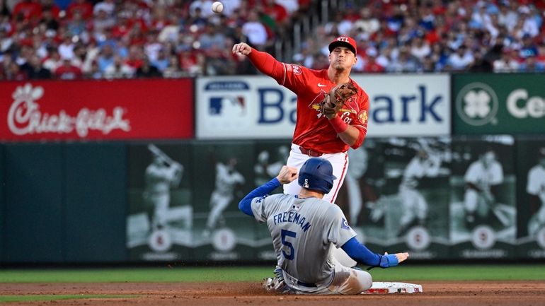 Los Angeles Dodgers' Freddie Freeman (5) is out at second...