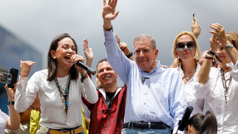 Opposition leader Maria Corina Machado, left, and opposition candidate Edmundo...