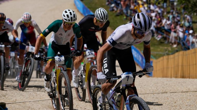 Riley Amos, of United States, leads Alan Hatherly, of South...