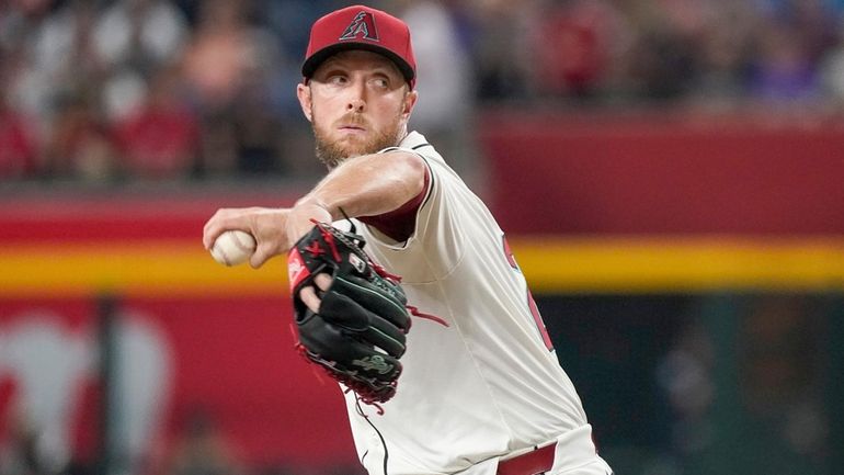 Arizona Diamondbacks pitcher Merrill Kelly throws against the Philadelphia Phillies...