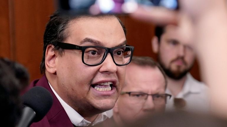 Rep. George Santos (R-Nassau/Queens) talks to reporters at the Capitol in...