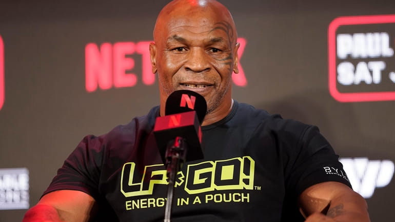Mike Tyson speaks during a news conference promoting his upcoming...