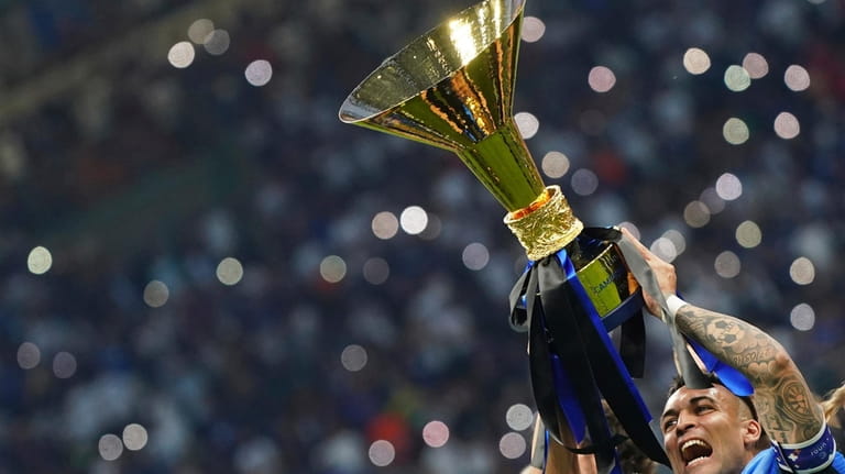 Inter's Lautaro Martinez celebrates winning the Scudetto after Serie A...