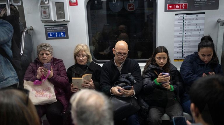 Commuters travel via subway, in Buenos Aires, Argentina, Friday, May...