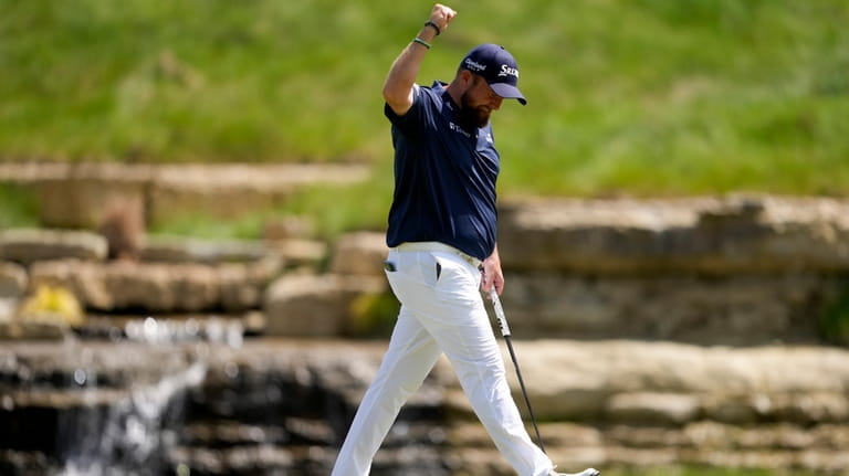 Shane Lowry, of Ireland, celebrates after a birdie on the...
