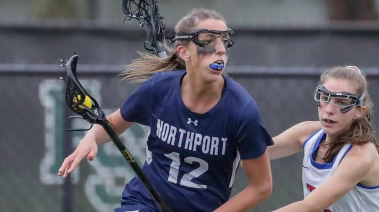 Danielle Pavinelli #12 of Northport moves the ball during the Suffolk...