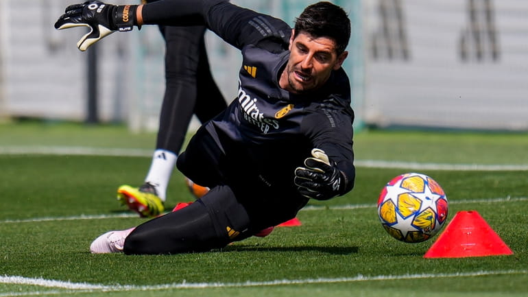 Real Madrid's goalkeeper Thibaut Courtois attends a training session during...