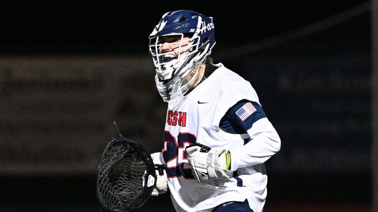 Goalie Carsen Kirchner of Cold Spring Harbor reacts to his...