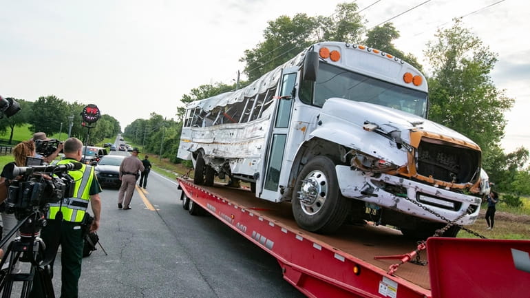A bus is removed after it collied with a small...