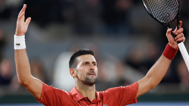 Serbia's Novak Djokovic plays the crowd during his third round...