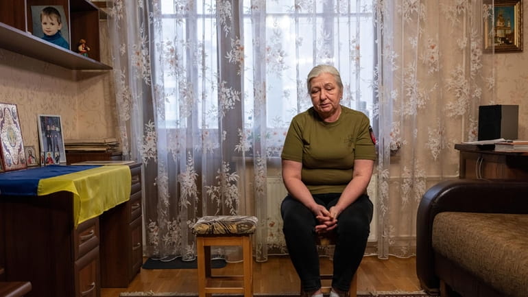 Iryna Reva, 59, waits for her son Vladyslav at her...