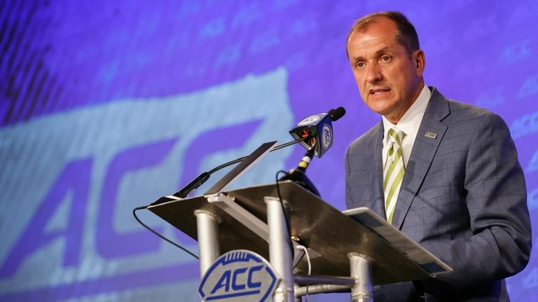 Atlantic Coast Conference commissioner Jim Phillips speaks during an NCAA...