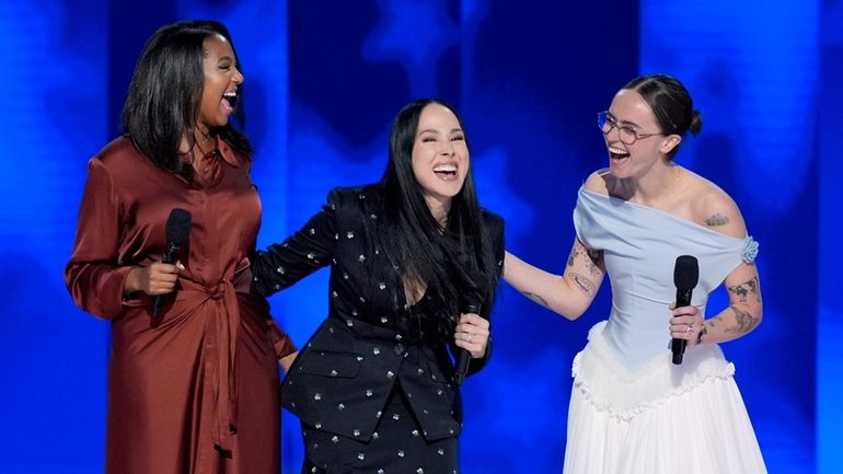 Helena Hudlin, from left, Meena Harris and Ella Emhoff speak...