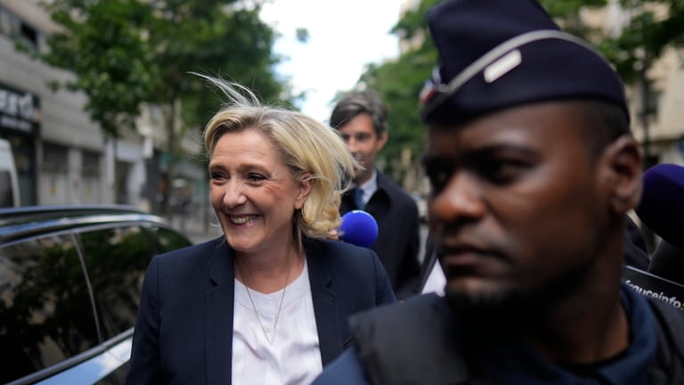 Far-right leader Marine Le Pen arrives at the National Rally...