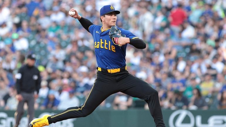 Seattle Mariners starting pitcher Bryan Woo throws during the third...