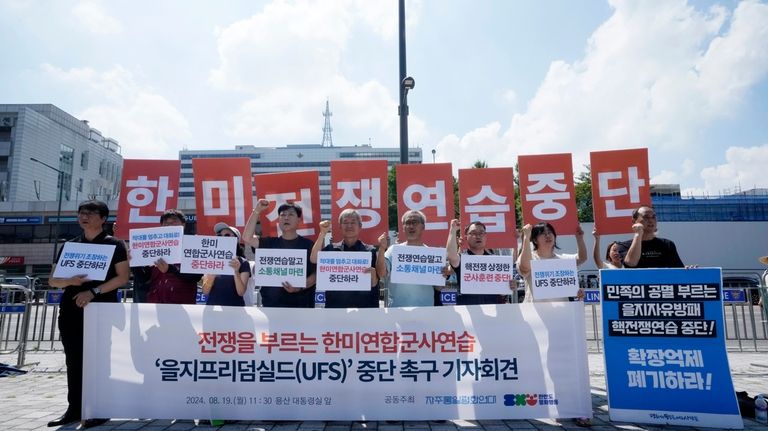 South Korean protesters stage a rally to oppose the joint...