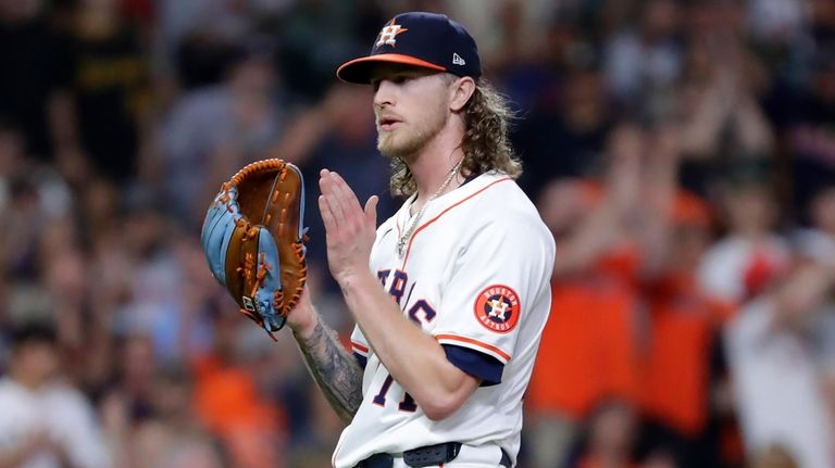 Houston Astros closing pitcher Josh Hader reacts to their 5-4...