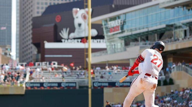 Minnesota Twins' Ryan Jeffers hits an RBI double in the...