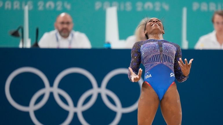 Simone Biles, of the United States, performs on the floor...