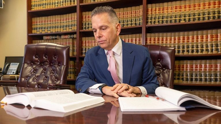 Elder care attorney John Dalli in his Mineola office.