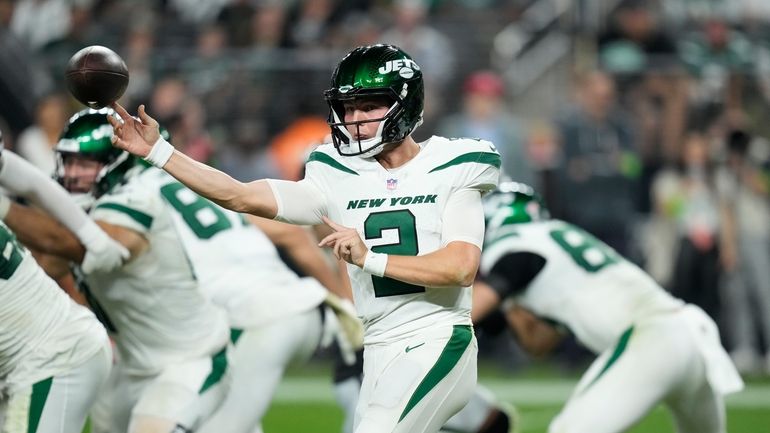 Jets quarterback Zach Wilson throws during the second half of...