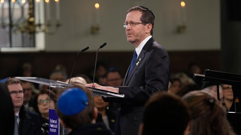 Israel's President Isaac Herzog speaks at the Portuguese Synagogue during...