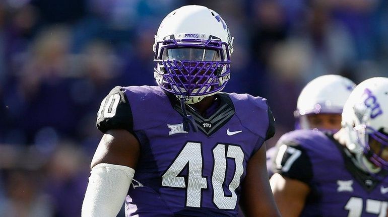 Defensive end James McFarland of the TCU Horned Frogs looks...