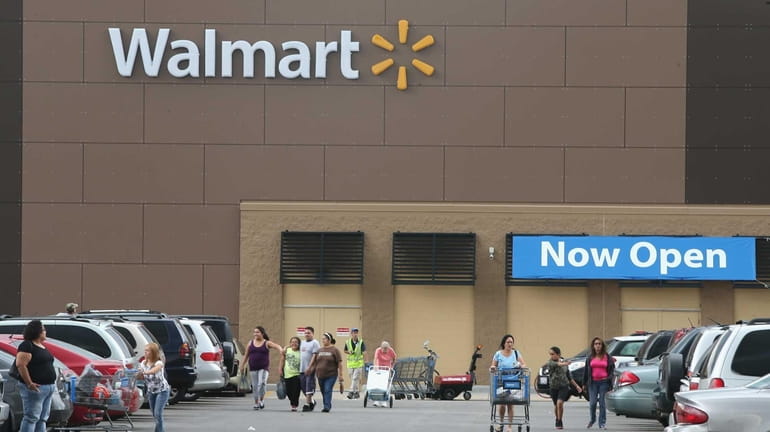Customers shop at a Walmart store in Chicago. The world's...